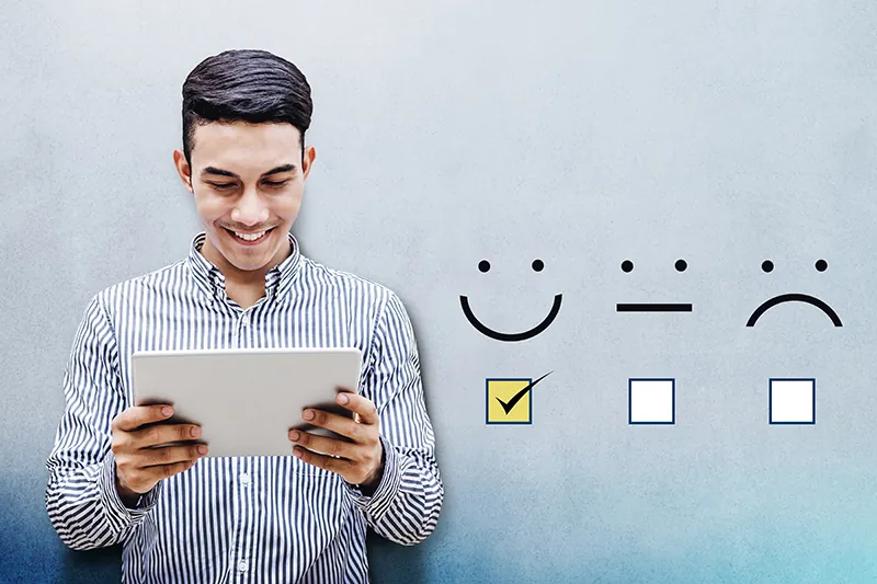 Employee Digital Engagement - man holding a tablet with 3 graphics showing degrees of employee satisfaction