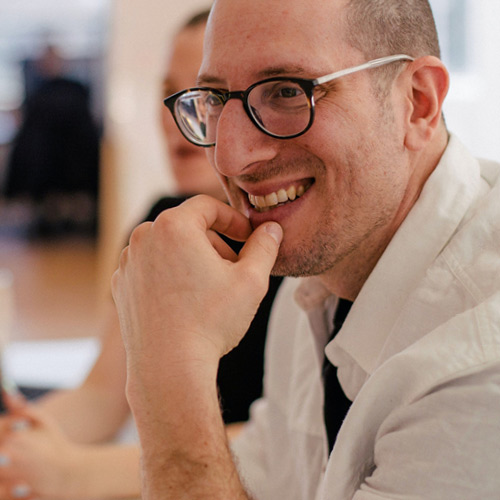 Engaged employee man smiling and in glasses