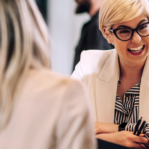 CXO woman with glasses in meeting