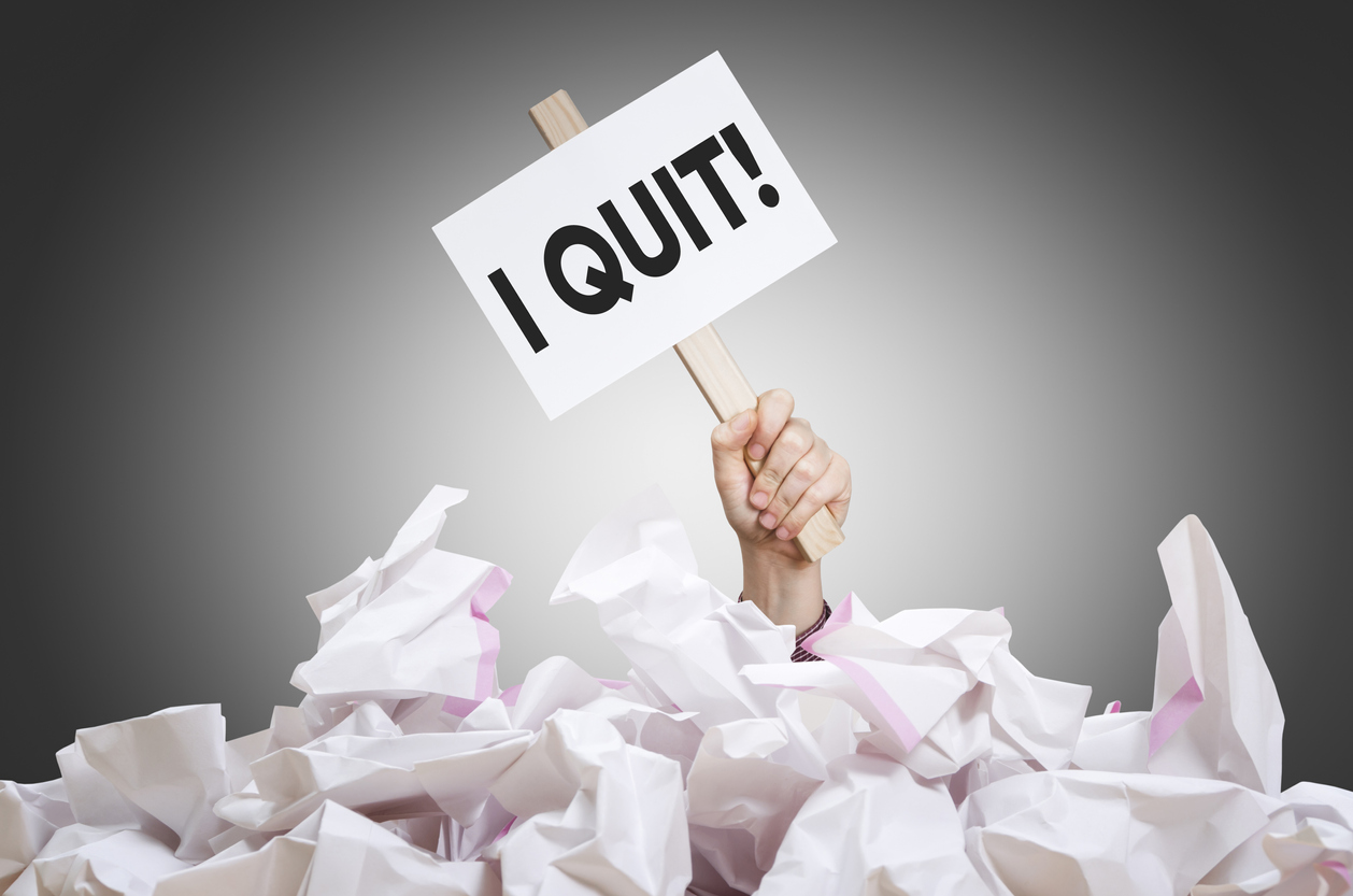Employee retention - hand holding out a sign that says I Quit!