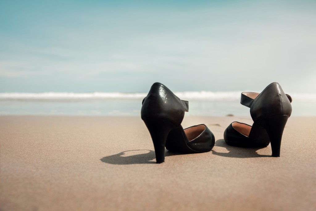 A pair of shoes on the beach