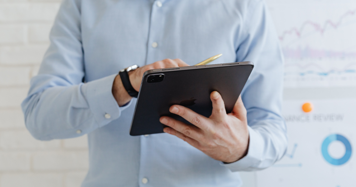 Outdated intranet - male employee holding tablet and stylus