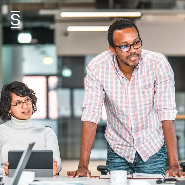 Communication styles - male and female employee collaborating and communicating with each other