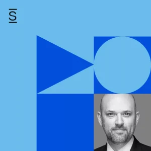 S2 Ep 51 Podcast - Headshot of Brian Brockman with light blue circle, dark blue triangle, and dark blue square