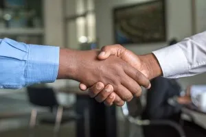 Intranet solution - employees shaking hands