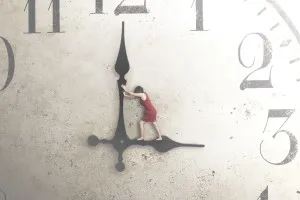 Professional development - Person standing on the hands of a clock trying to stop time