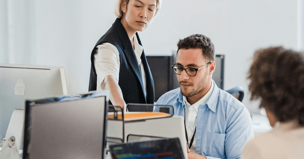 An image that implies IT and IC in a meeting discussing priorities (no conflict)