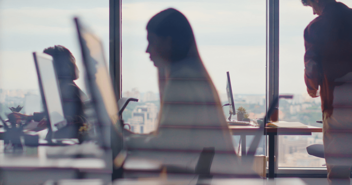 Employees working on modular AI workflows and scalable digital intelligence in an office.