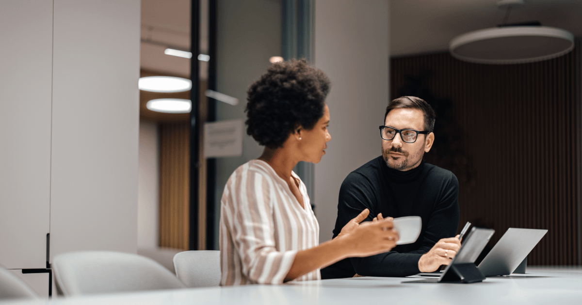 Managers collaborating to improve AI adoption and engagement at work