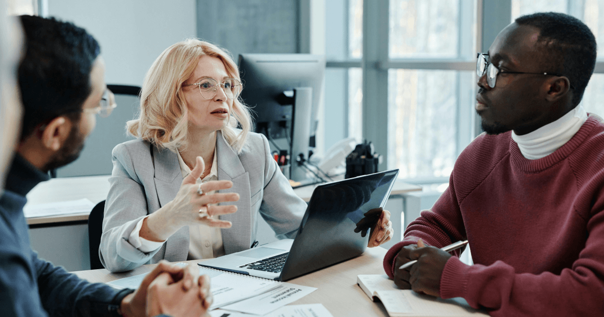 Managers collaborating to improve AI adoption and engagement at work